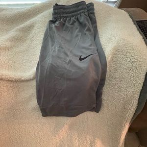Nike men’s medium shorts in gray with black swoosh